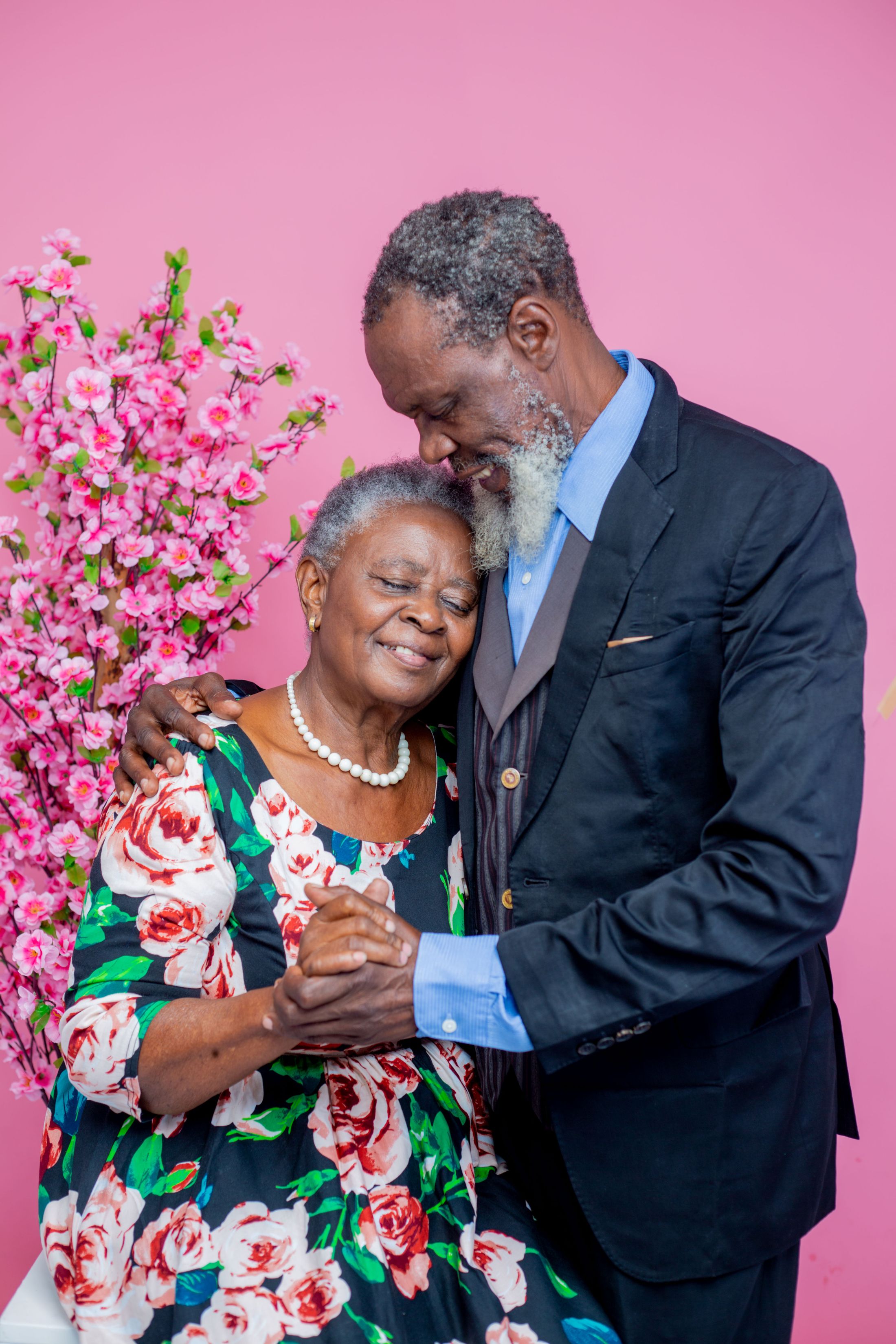 A mature Black couple sharing a warm embrace